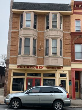 Coatesville apartment for rent - a silver car parked in front of a building