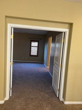 Tulare house for rent - a hallway with a door and a window in it
