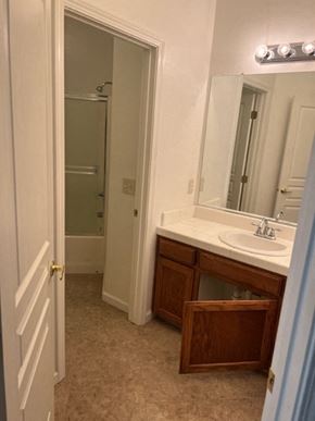 Tulare house for rent - a bathroom with a sink and a mirror