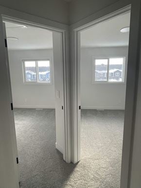 Edmonton apartment for rent - a bedroom with a view of the living room and bedroom door open