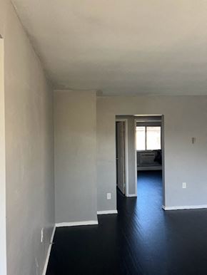 Cincinnati apartment for rent - an empty room with white walls and a black floor