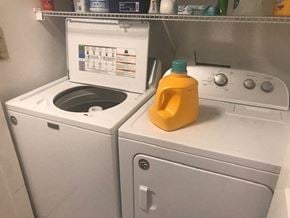 Atlanta house for rent - a white washing machine with a yellow jug on it