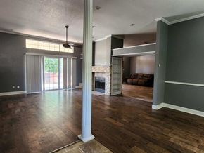 Copperas Cove house for rent - a living room with a fireplace and a hard wood floor