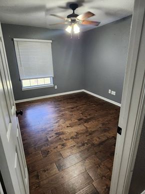 Copperas Cove house for rent - a empty room with wood floors and a ceiling fan