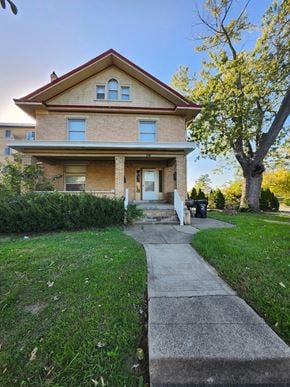 Cincinatti apartment for rent - A house with a red roof and a front porch.