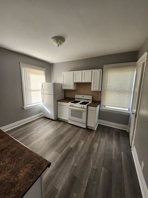 Cincinatti apartment for rent - A kitchen with a stove top oven and a refrigerator.