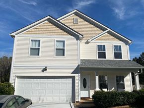 Waxhaw house for rent - a white house with a white garage door