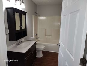 Clearfield house for rent - A bathroom with a white sink and a white toilet.