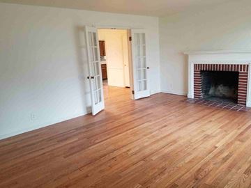 Warren house for rent - a living room with wood flooring and a fireplace