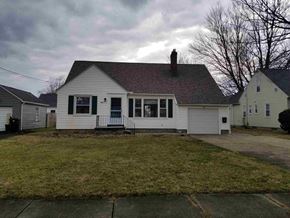Warren house for rent - the front of a white house with a grassy yard and two white houses