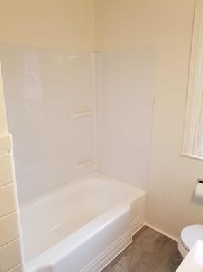 Warren house for rent - a white bathroom with a tub and a toilet