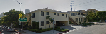 Los Angeles apartment for rent - an apartment building on a city street with a street sign