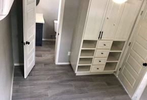 Brownsville apartment for rent - a bathroom with a closet with shelves and a door