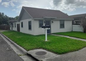 Brownsville apartment for rent - a white house with a mailbox in the grass