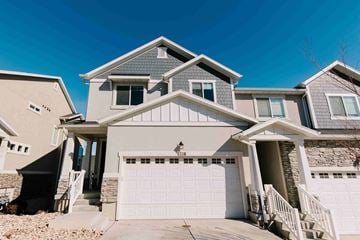 Herriman house for rent - a house with a white garage door in front of it