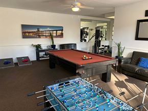 Huntington Beach apartment for rent - a game room with a pool table and a foosball