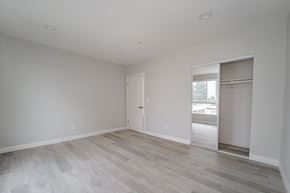 North Hollywood apartment for rent - an empty living room with white walls and a sliding glass door