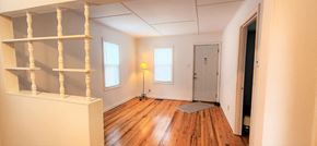 Hammond apartment for rent - A room with a white door and a window with a lamp on the side.