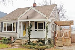 Hammond apartment for rent - A house with a yellow door and a porch.