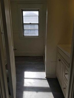 Warren house for rent - A white door is open to a hallway with a window.