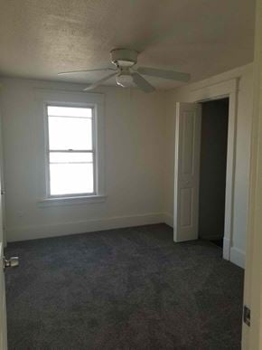 Warren house for rent - A room with a ceiling fan and a window.