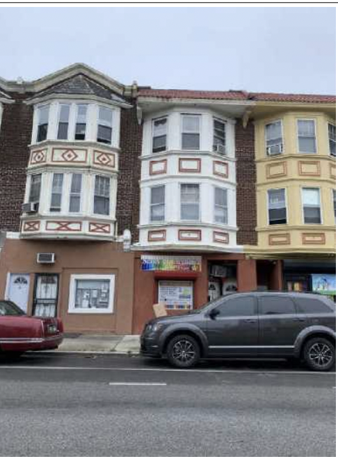 Philadelphia apartment for rent - a car parked in front of a building on a street
