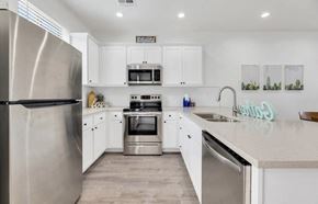Phoenix apartment for rent - a white kitchen with stainless steel appliances and white cabinets