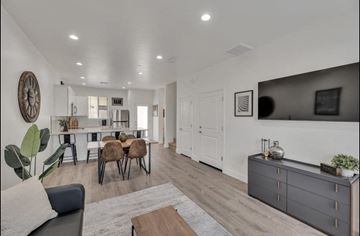 Phoenix apartment for rent - an open living room and kitchen with a dining room table and chairs