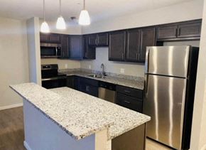 Newburgh apartment for rent - a kitchen with granite counter tops and stainless steel appliances