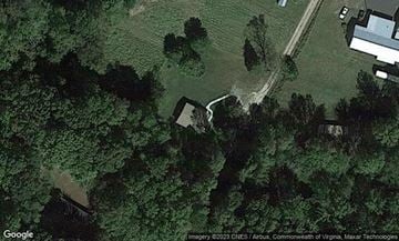 Mount Airy house for rent - A satellite image shows a rural area with a few buildings and a winding road.