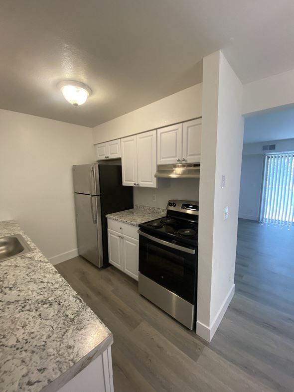 Clinton Township apartment for rent - a kitchen with stainless steel appliances and marble counter tops