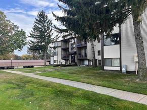 Clinton Township apartment for rent - our apartments are located in a quiet area with a walkway and grass