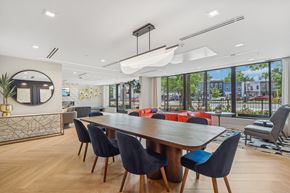 Washington apartment for rent - a dining room with a table and chairs and a large window