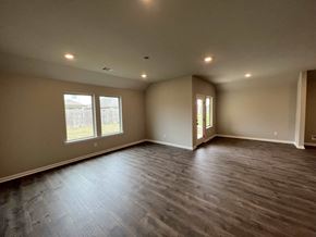 Youngsville house for rent - a empty living room with wooden floors and a window