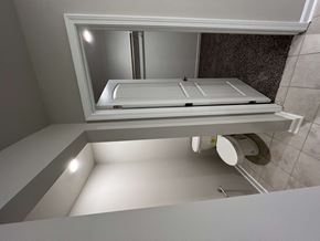 Youngsville house for rent - a small bathroom with a sink and a toilet and a window