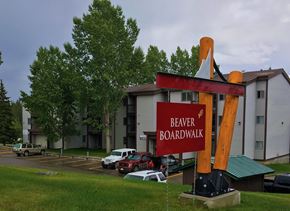 Hinton apartment for rent - A sign that says Beaver Boardwalk stands in front of a building.