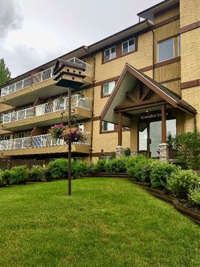 Hinton apartment for rent - A building with a balcony and a sign that says "Harmony House".