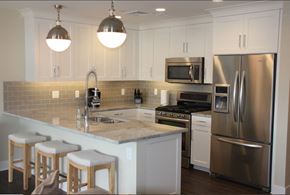 Grand Rapids apartment for rent - a kitchen with stainless steel appliances and white cabinets