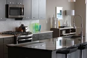 Grand Rapids apartment for rent - a modern kitchen with stainless steel appliances and counter tops