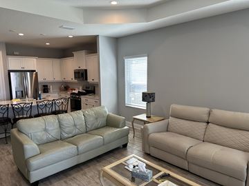 Parrish house for rent - a living room with couches and a coffee table