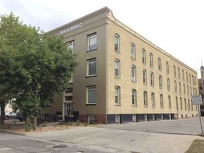 Fargo apartment for rent - a large brick building on the side of a street