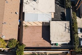 Palm Desert apartment for rent - an aerial view of the roof of a building with a white fence