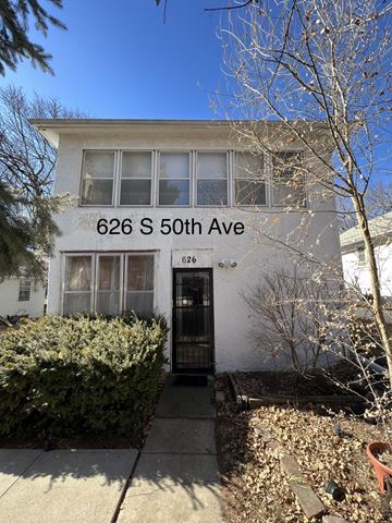 Omaha apartment for rent - A white house with the number 626 on the front.