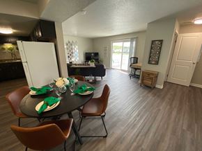 Speedway apartment for rent - A dining room with a table set for a meal.