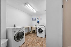 Burnaby apartment for rent - A laundry room with a washer and dryer.
