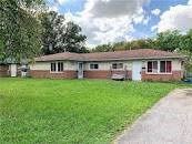 Youngstown house for rent - a house with a yard and a road in front of it