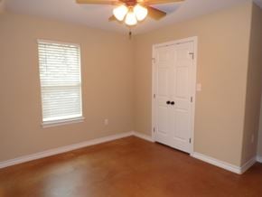 Buchanan Dam apartment for rent - an empty living room with a ceiling fan and a white door