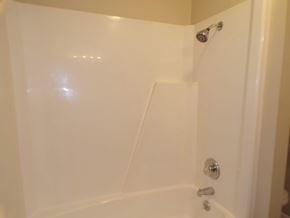 Buchanan Dam apartment for rent - A white bathtub with a shower head and faucet.