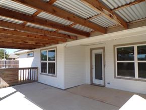 Burnet house for rent - the covered porch is under a roof with a door