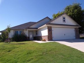 Burnet house for rent - a white house with a lawn and a driveway